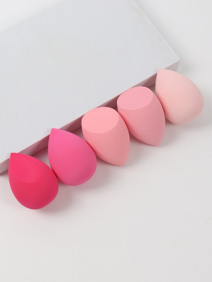 Bags of Beauty Eggs Makeup - Ensemble d'éponges de maquillage en différentes teintes sur fond blanc.