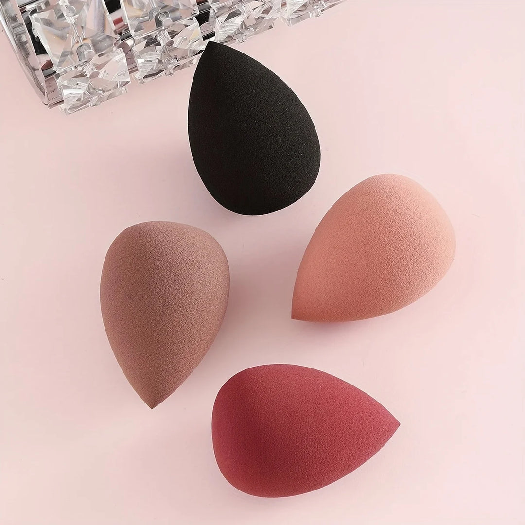 Bags of Beauty Eggs Makeup - quatre éponges de maquillage en différentes teintes sur fond rose
