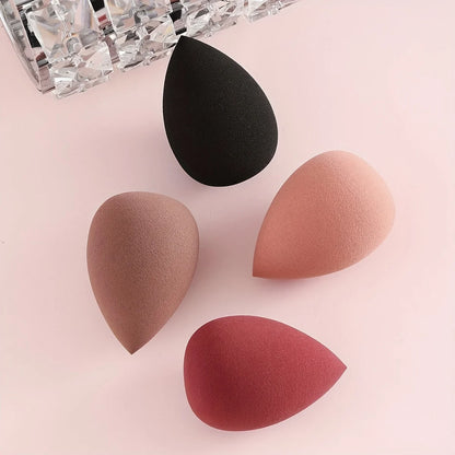 Bags of Beauty Eggs Makeup - quatre éponges de maquillage en différentes teintes sur fond rose